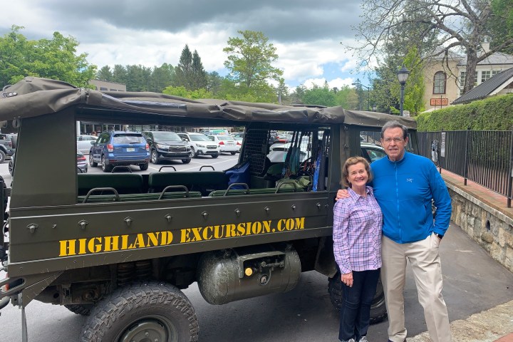 a man standing next to a truck