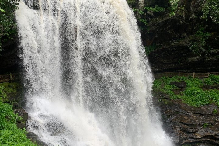a large waterfall coming out of the water