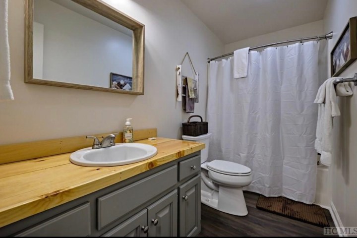 a shower that has a sink and a mirror