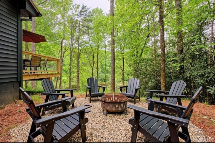 a group of lawn chairs sitting on top of a picnic table