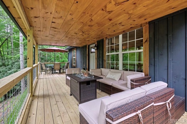 a wooden bench sitting next to a window