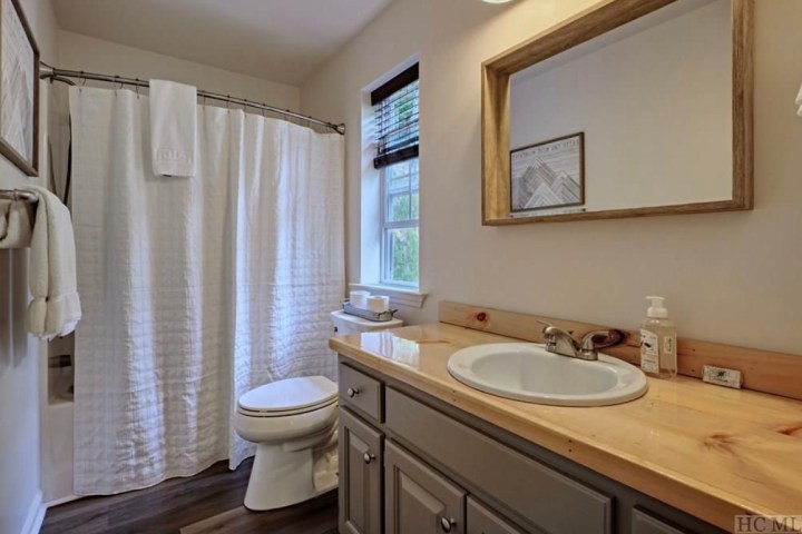 a double sink and large mirror